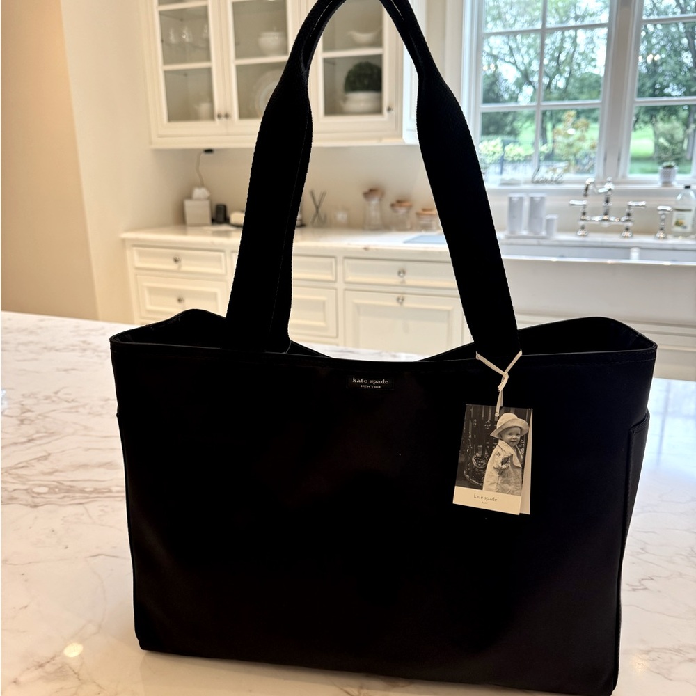 NWT Vintage Kate Spade New York black nylon diaper bag. Includes changing pad.
